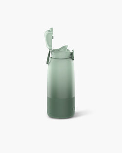 WEMOH F1 portable bottle warmer in green with open lid, showing travel-ready design, leakproof cap, and bottle warming setup.
